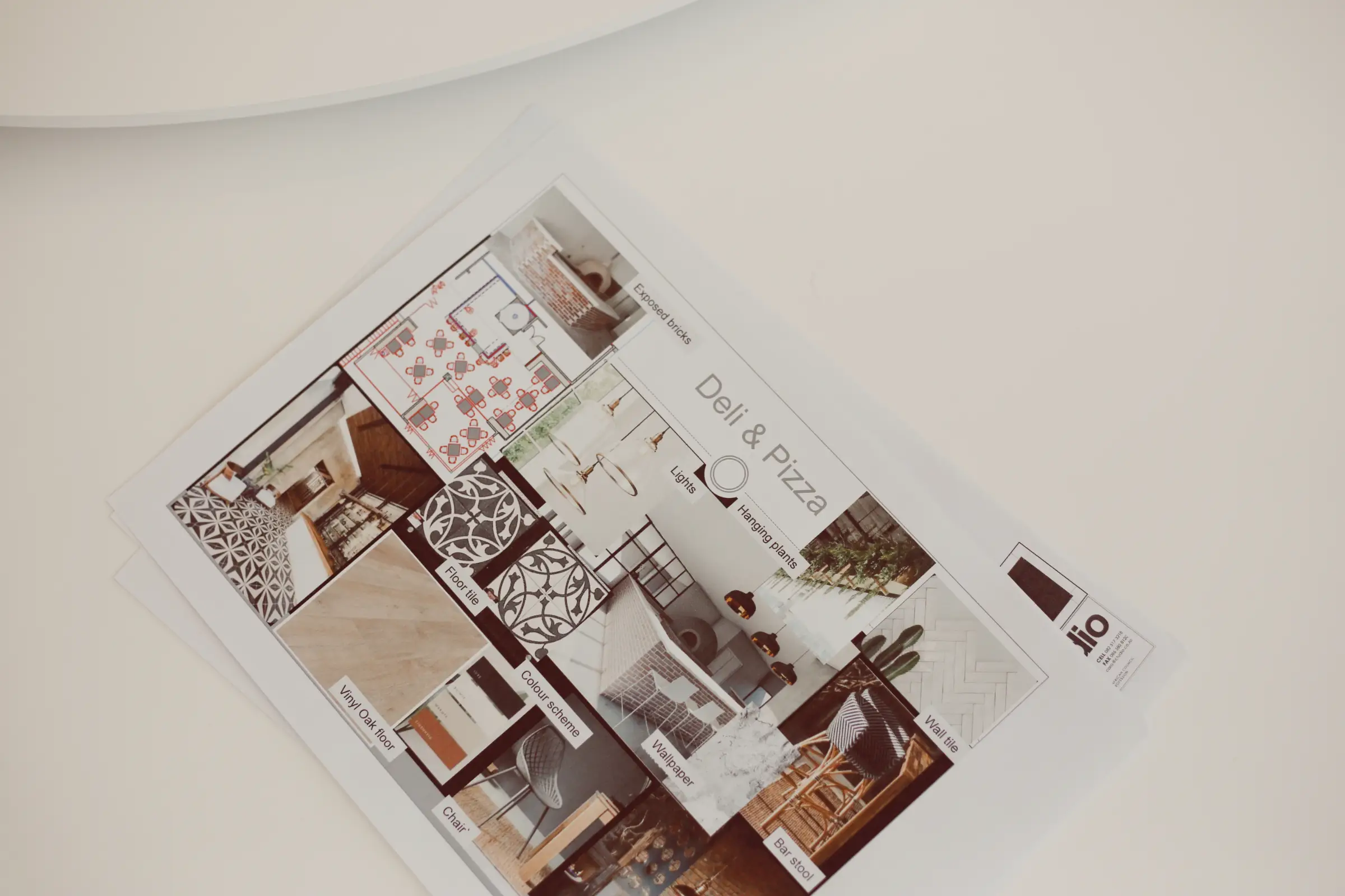 An interior designer's mood board laying on a light surface