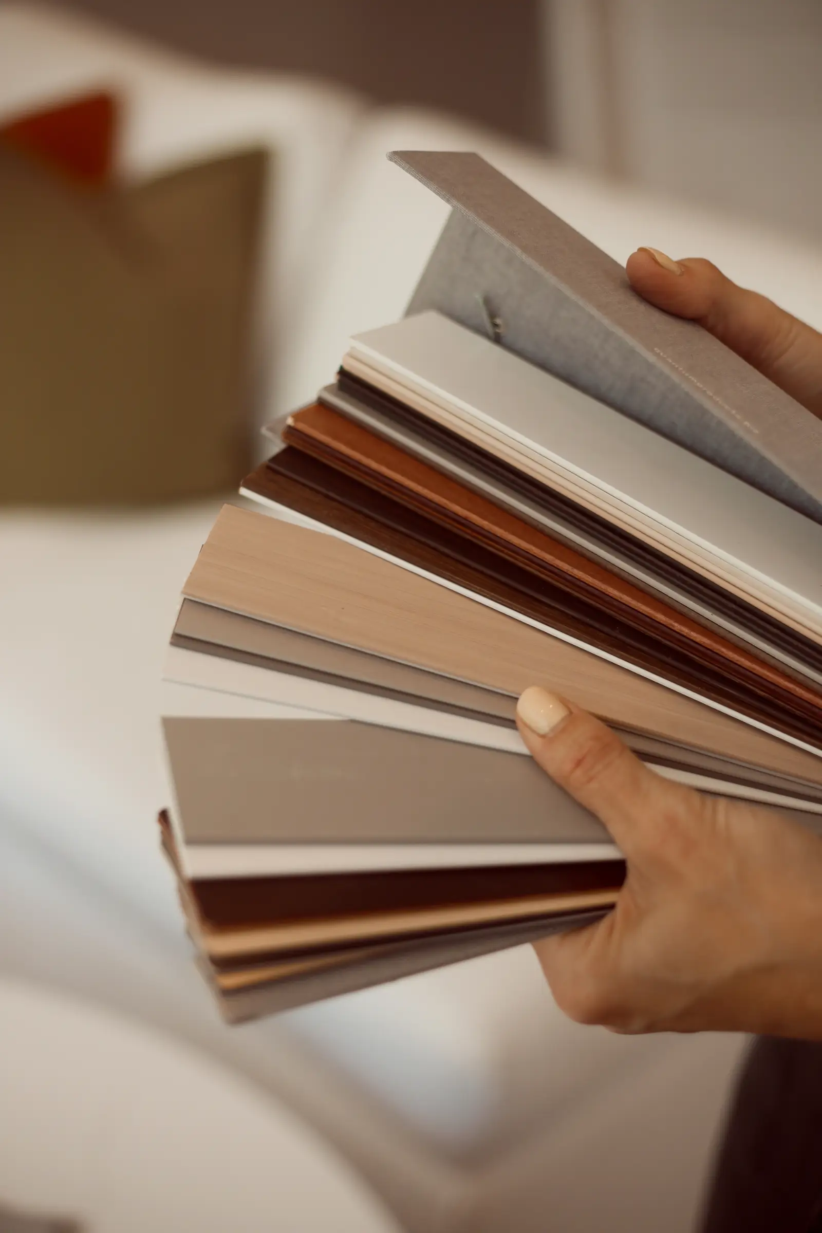 Hands holding a swatch palette.